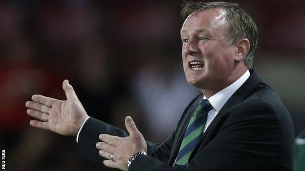 Michael O'Neill delivers instructions to Northern Ireland players during Sunday's qualifier in Prague