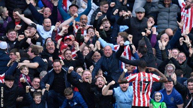 Ivan Toney celebrates in front of the Brentford fans