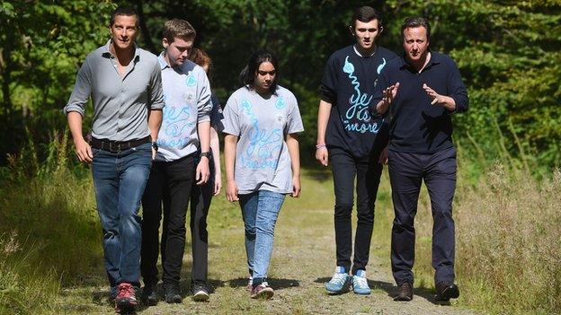 David Cameron and Bear Grylls with young volunteers