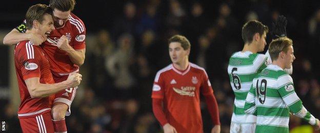 Ash Taylor and Graeme Shinnie celebrate