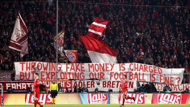 Bayern Munich fans hold a banner