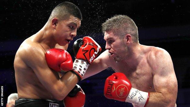 Liam Smith (right) grapples with Jaime Munguia