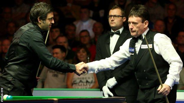 Ronnie O'Sullivan and Jimmy White shake hands before their encounter in Belfast on Wednesday