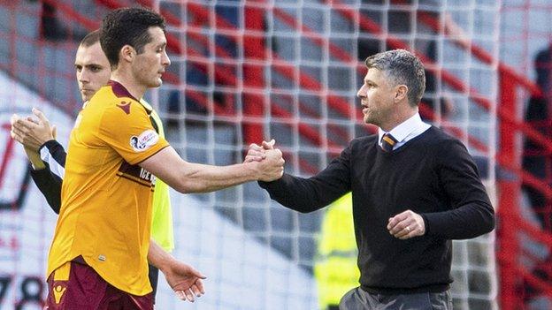 Motherwell manager Stephen Robinson (right) celebrates at full-time with Carl McHugh