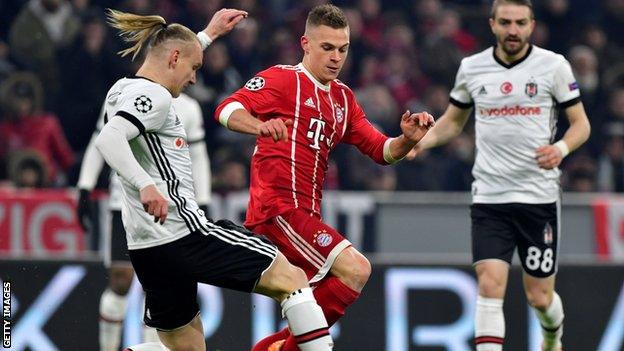 Joshua Kimmich (centre) runs with the ball