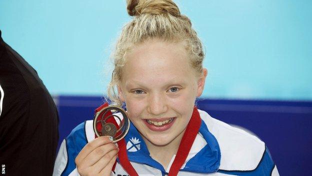 Erraid Davies receives the bronze medal in the para-sport 100m breaststroke at the 2014 Commonwealth Games in Glasgow