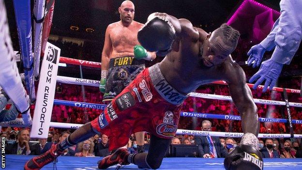 Deontay Wilder falls to the canvas