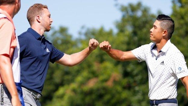 Daniel Berger (left) fist-bumps Collin Morikawa after their play-off at Colonial Country Club