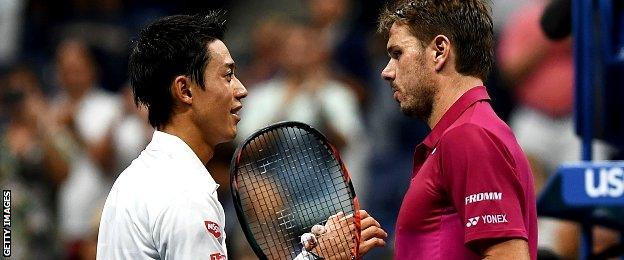 Stan Wawrinka (R) of Switzerland is congratulated by Kei Nishikori