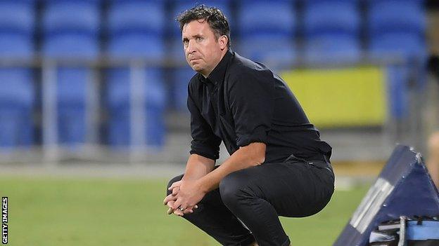 Former Liverpool and England striker Robbie Fowler watches from the touchline while in charge of Australian side Brisbane Roar