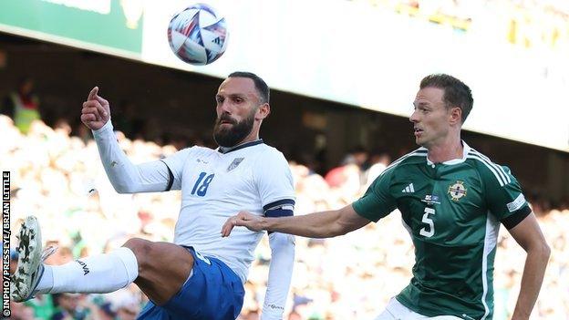 Jonny Evans in action against Kosovo