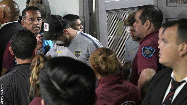 Boca Juniors midfielder Pablo Perez (centre) and defender Leonardo Balerdi return from hospital to the Monumental stadium