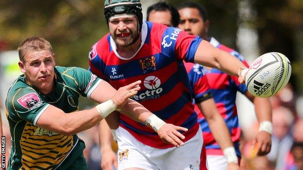 Jake Ashby (left) plays a pass