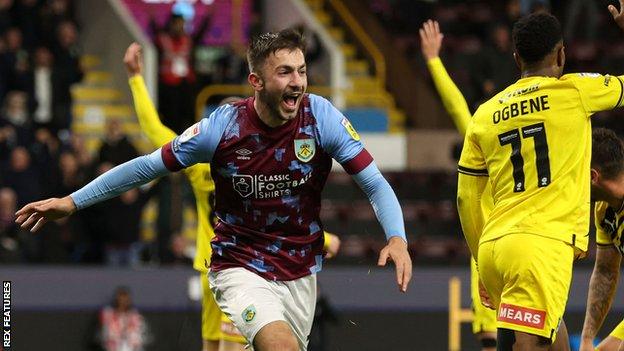 Burnley's Halil Dervisoglu of Burnley celebrates scoring to make it 3-2