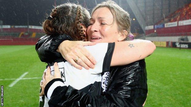 Giselle Mather congratulates Amy Garnett after they win the Inaugural Representative Match between Barbarians Women's RFC and Munster Women, on November 10, 2017 in Limerick, Ireland.