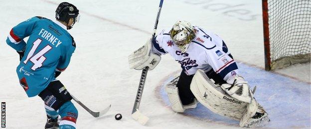 Mike Forney scores past former Coventry Blaze netminder Trevor Koenig