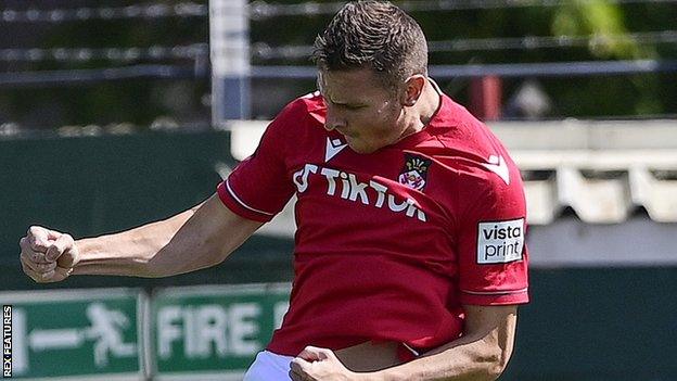 Paul Mullin celebrates a goal for Wrexham