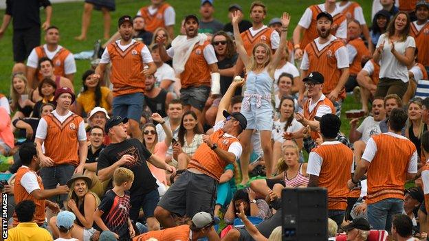 A fan takes a one-handed catch in the crowd during England's T20 victory over New Zealand