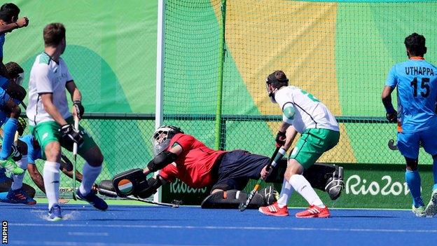 Ireland keeper David Harte fails to keep out this shot as India score in the Pool B game