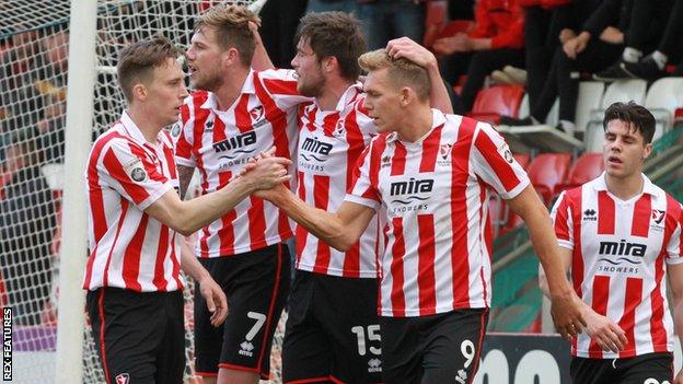 Danny Wright (second from right) celebrates his goal against Lincoln