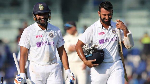 India's Rohit Sharma and Cheteshwar Pujara