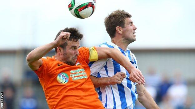 Linfield striker Andrew Waterworth and Coleraine's Steven Douglas contest a high ball