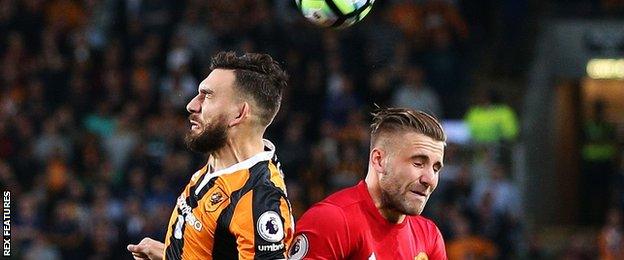 Hull City's Robert Snodgrass challenges Manchester United's Eric Bailly