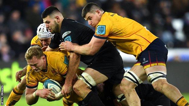 Kieran Treadwell is tackled during Ulster's defeat by Ospreys