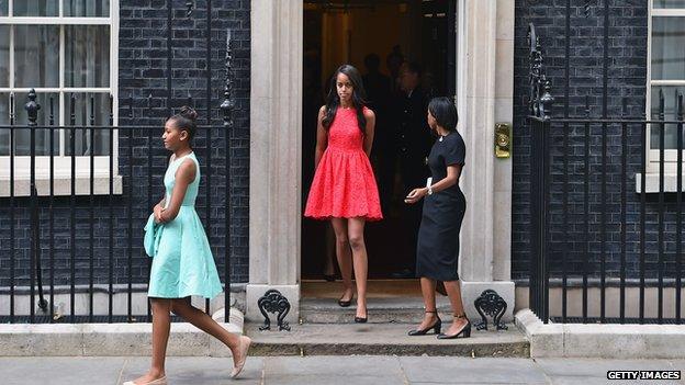 Sasha (l) and Malia Obama leave Downing Street