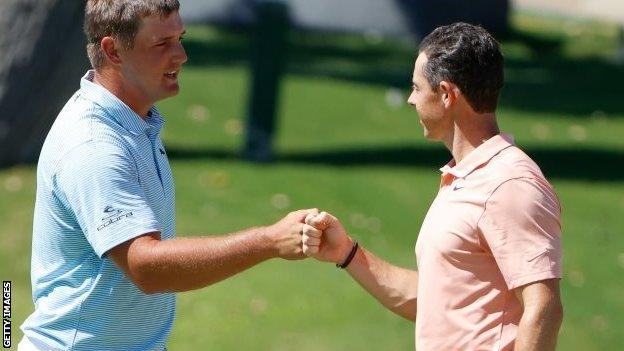 Bryson DeChambeau and Rory McIlroy fist-bump at Colonial Country Club