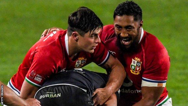 Louis Rees-Zammit of the British and Irish Lions and Bundee Aki of the British and Irish Lions tackling Manie Libbok