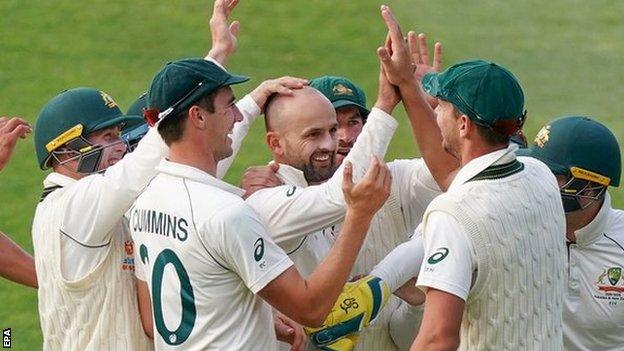 Australia celebrate after spinner Nathan Lyon takes a wicket against Pakistan