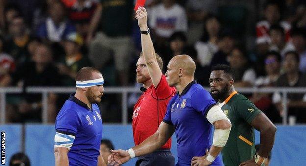 Andrea Lovotti (left) is sent off by referee Wayne Barnes