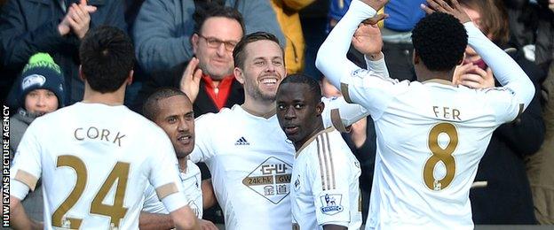 Gylfi Sigurdsson celebrates his goal with Swansea team-mates