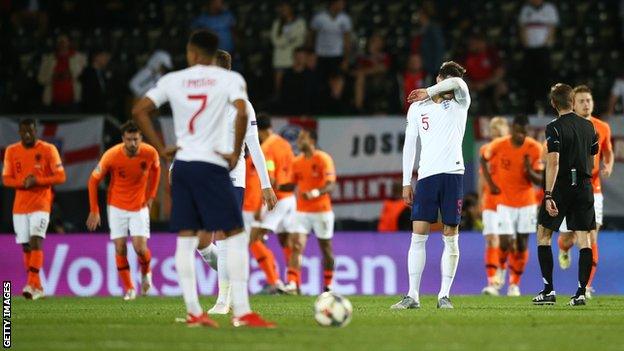 England players (including John Stones - number five) look distraught