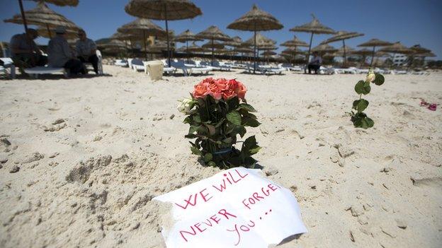 Flowers are placed at the scene of the Tunisian beach attack