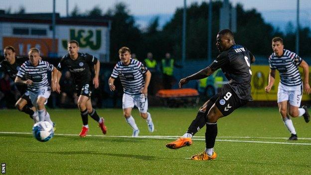 Dipo Akinyemi scores a penalty for Ayr United against Queen's Park