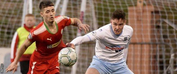 Cliftonville's Jay Donnelly in action against Ballymena defender Kofi Balmer