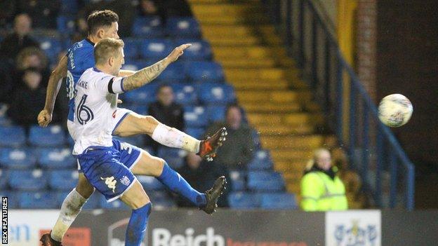 Rochdale's Ian Henderson scores