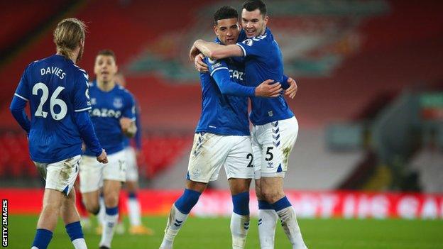 Everton players celebrate their win at Anfield