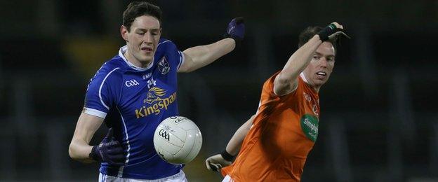 Cavan forward Michael Argue attempts to move clear of Armagh's Tony Kernan