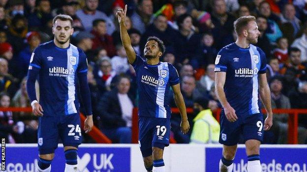 Duane Holmes celebrates his goal