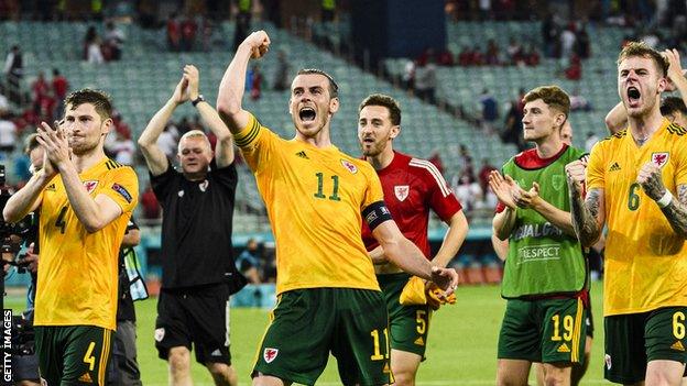 Wales celebrate after goals from Aaron Ramsey and Connor Roberts secured victory over Turkey