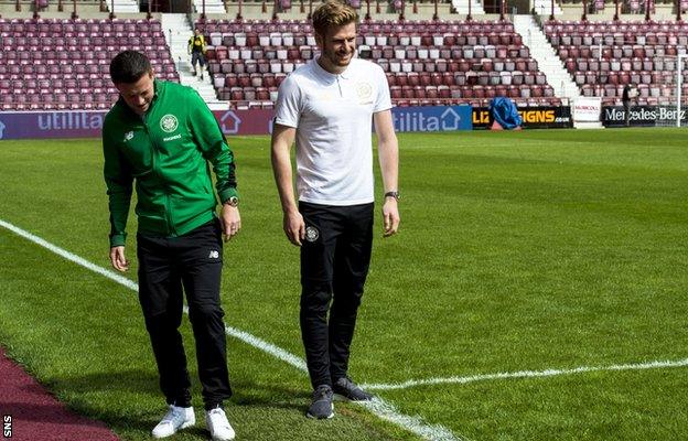 Celtic's Callum McGregor and Stuart Armstrong laugh as they test the Tynecastle pitch before kick-off