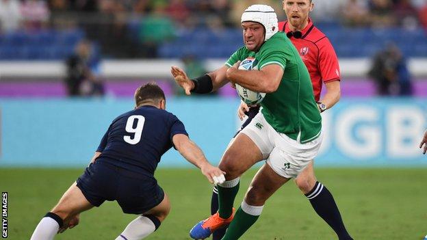 Rory Best attempts to get past Scotland's Greig Laidlaw in Yokohama