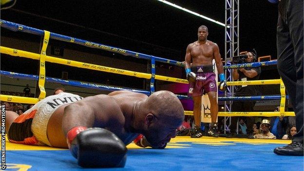 Daniel Dubois looks on as Trevor Bryan is on the ground