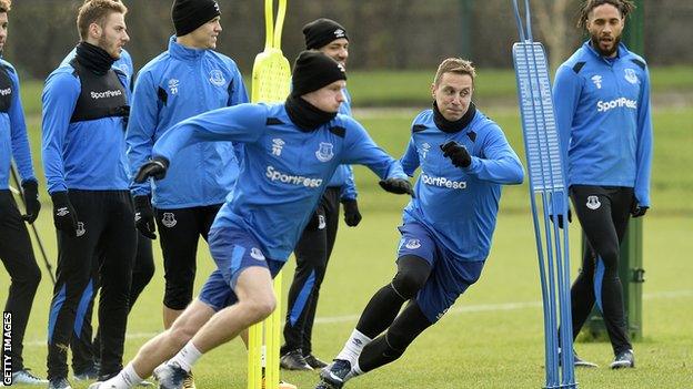 Phil Jagielka and Wayne Rooney start a sprinting drill at Everton's Finch Farm training ground