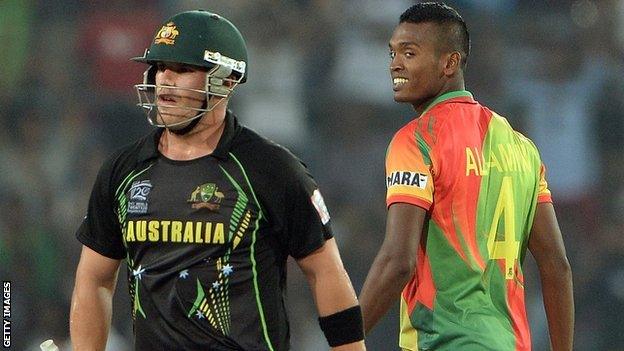 Australia's Aaron Finch and Bangladesh's Al-Amin Hossain