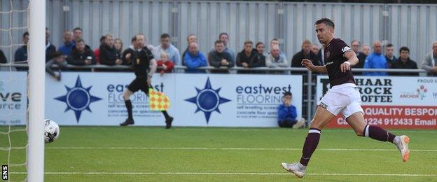 Heart of Midlothian's Olly Lee watches his shot hit the post