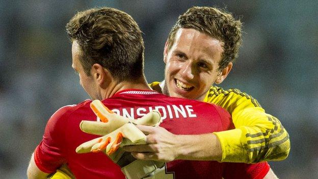 Andrew Considine and goalkeeper Danny Ward